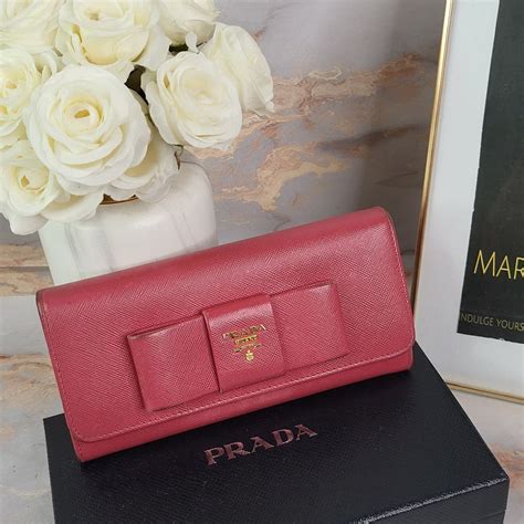 prada saffiano bow wallet singapore|farfetch prada wallet.